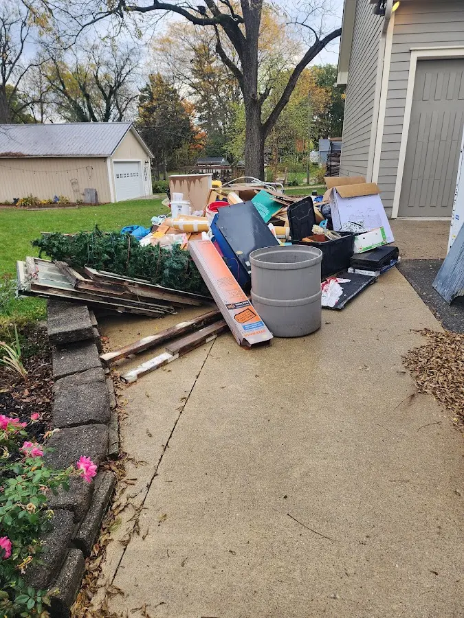 Dumpster being loaded with debris for Residential Dumpster Rental in Edgecliff Village